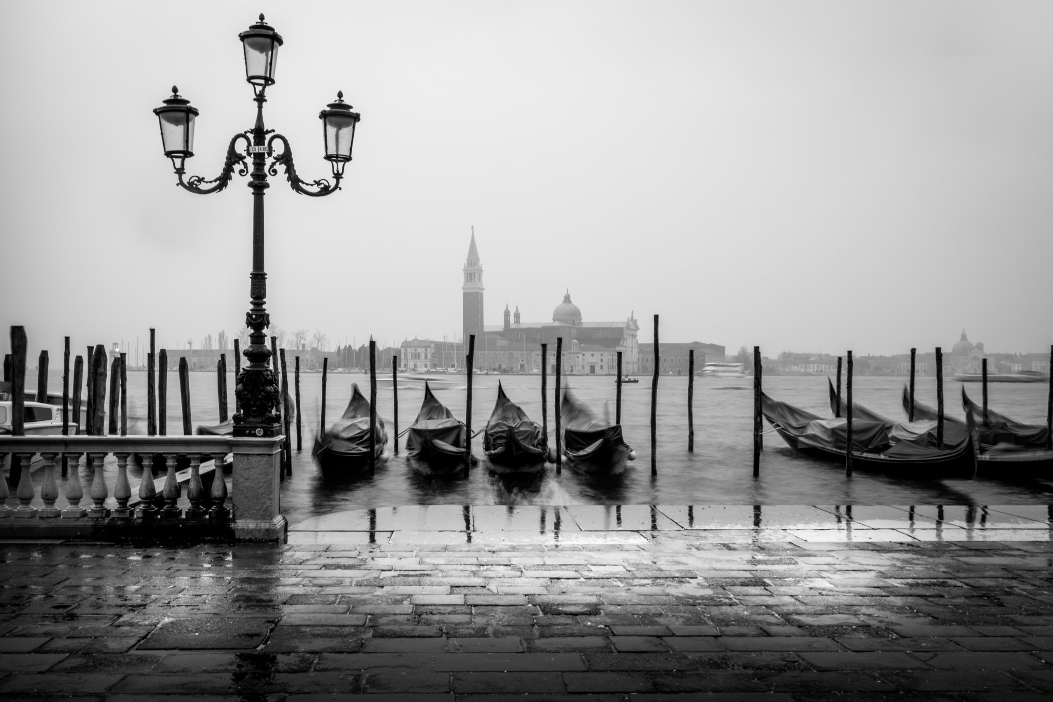 Black-and-white Venice gondolas in the mist by Serge Ramelli